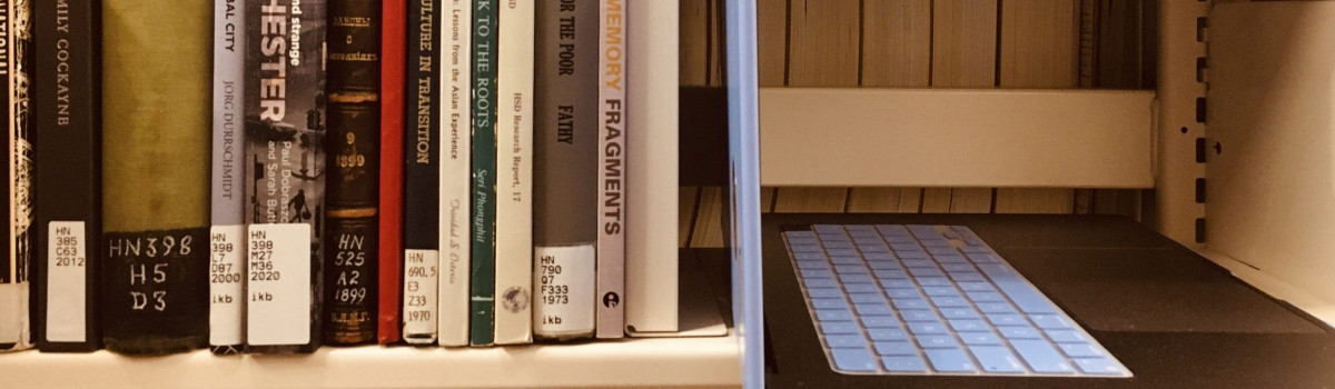 Books beside a laptop
